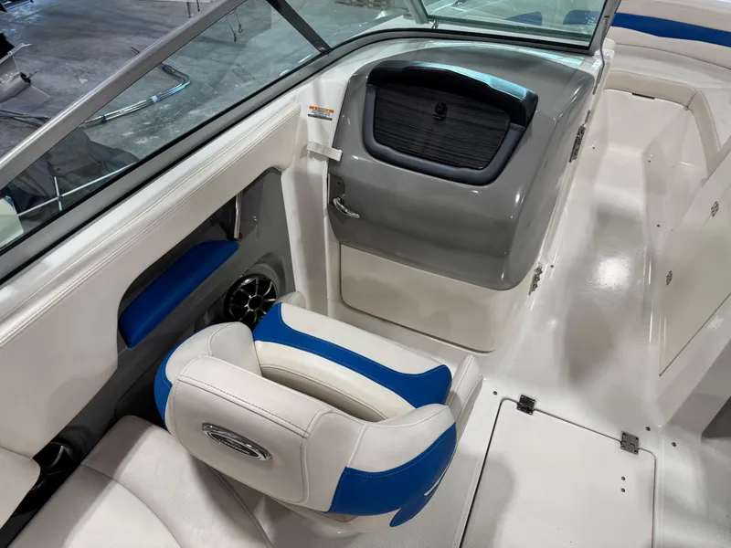 Slide: The Image of 2018 Chaparral 246 SSi Surf boat interior with blue and white seating. - 12