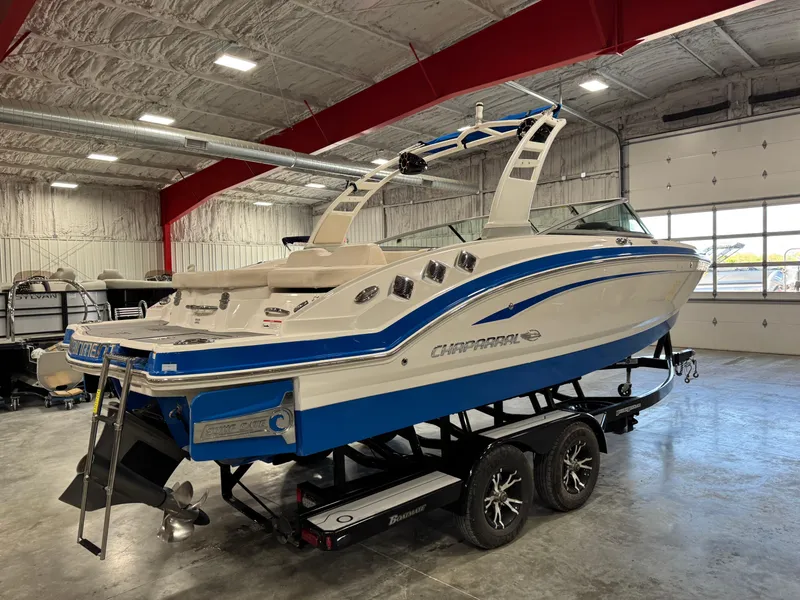 Slide: The Image of 2018 Chaparral 246 SSi Surf boat on trailer in indoor storage facility. - 3
