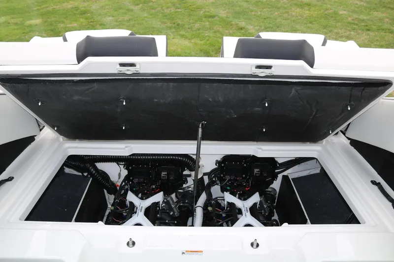 Slide: The Image of 2025 Yamaha Boats 222SE engine compartment with dual engines, open hatch, and visible components. - 18