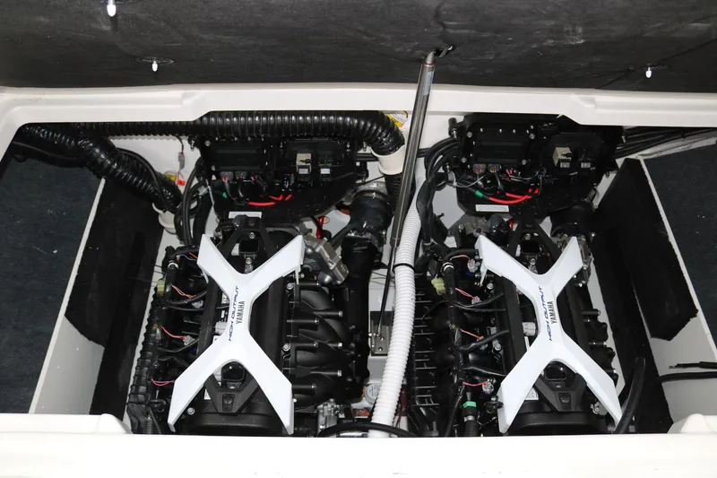 Slide: The Image of 2025 Yamaha Boats 222SE engine compartment with dual engines and wiring. - 19