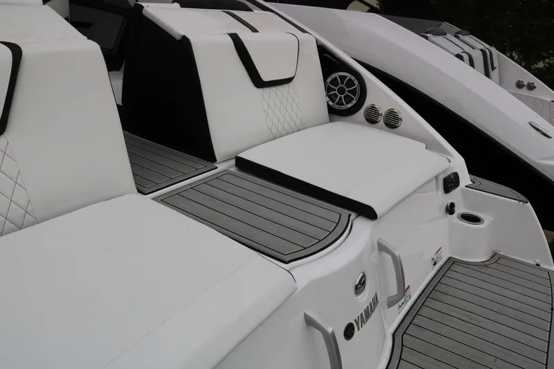 Slide: The Image of 2025 Yamaha Boats 222SE interior with white seating and modern design features. - 22