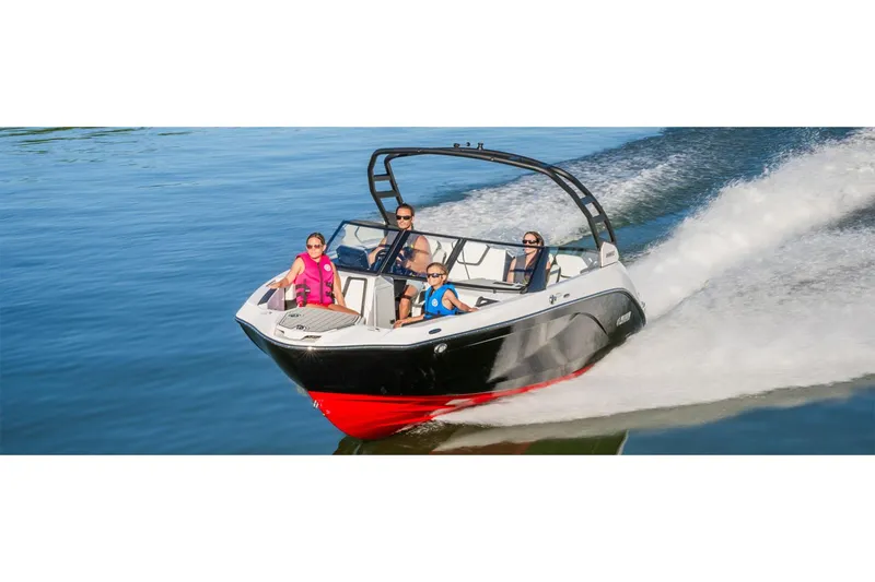 Slide: The Image of 2025 Yamaha Boats 222SE cruising on water with passengers enjoying the ride. - 39