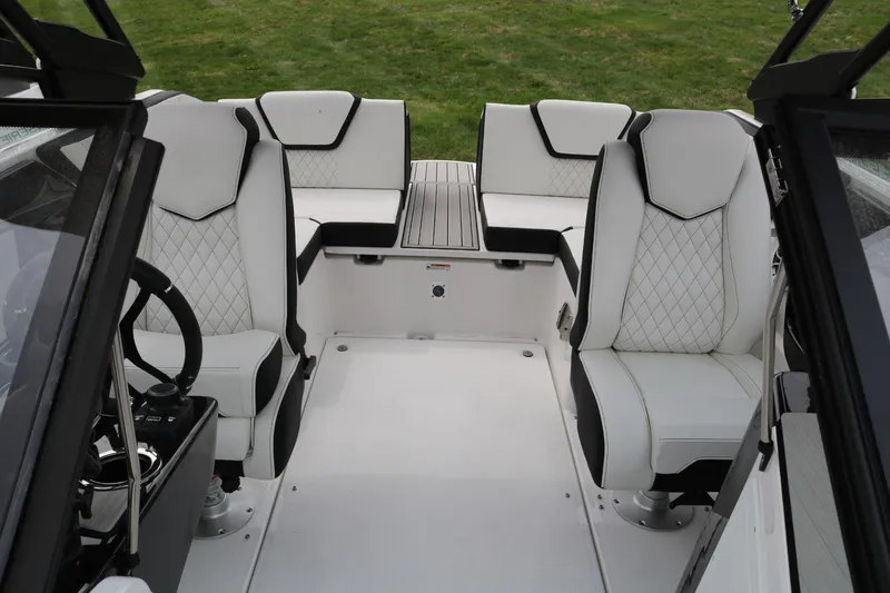 Slide: The Image of 2025 Yamaha Boats 222SE interior with white seating and modern design. - 7