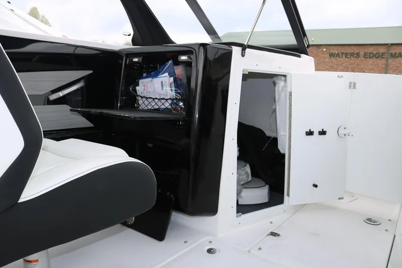 Slide: The Image of 2025 Yamaha Boats 222SE interior with storage compartments and seating. - 9