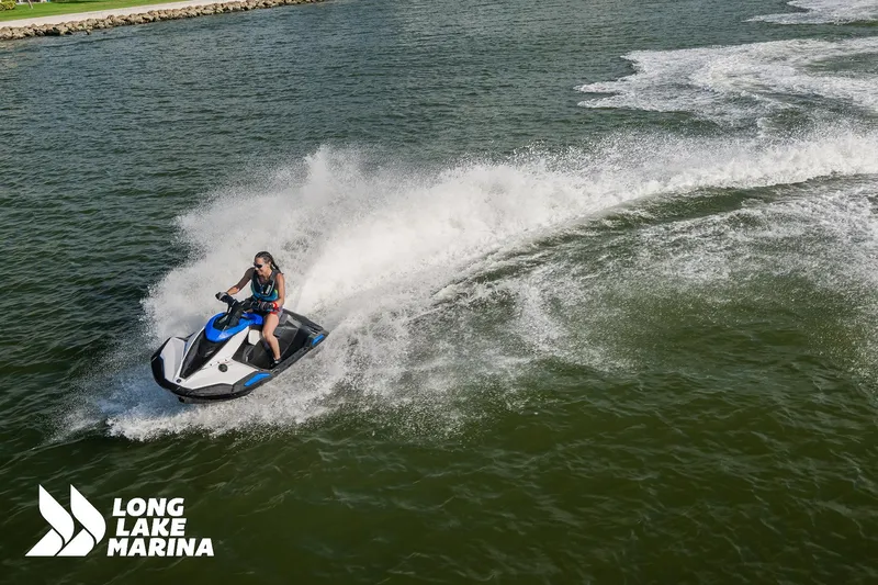 Slide: The Image of 2025 Yamaha Boats Black/Space Blue jet ski on water at Long Lake Marina. - 5