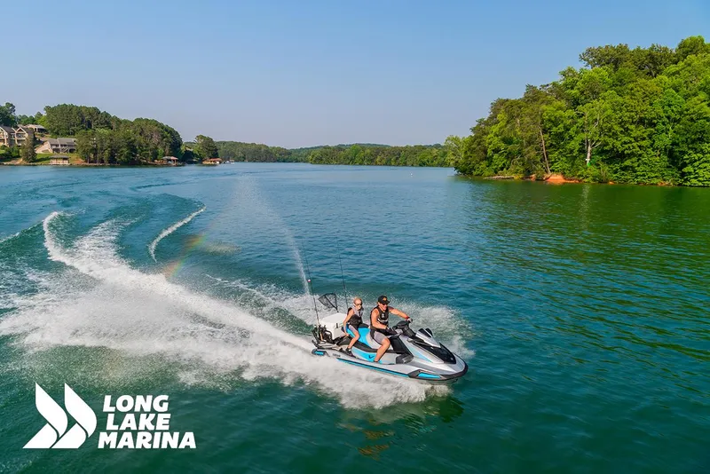 Slide: The Image of 2025 Yamaha VX Cruiser jet ski on a scenic lake at Long Lake Marina. - 5