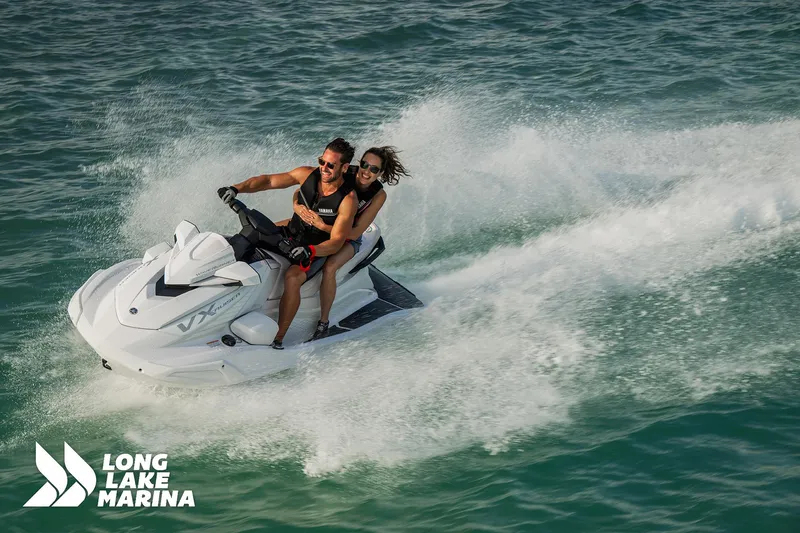 Slide: The Image of 2025 Yamaha VX Cruiser jet ski on water, two riders enjoying a sunny day. - 7