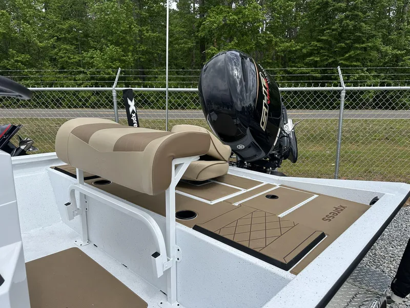 Slide: The Image of 2025 Xpress Hyper-Lift Bay Series 210 BAY-175 HP boat with Yamaha engine, beige seating. - 8