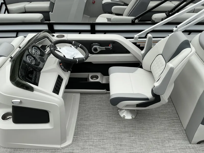 Slide: The Image of 2025 Avalon LSZ 23 Rear Lounger boat interior with modern helm and comfortable seating. - 9