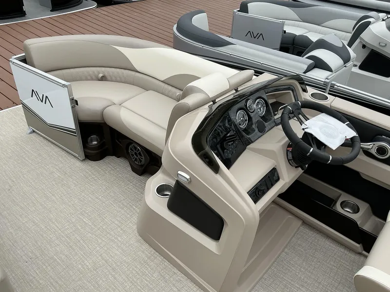 Slide: The Image of 2025 Avalon LSZ 23 Quad Lounger interior with beige seating and modern dashboard. - 5