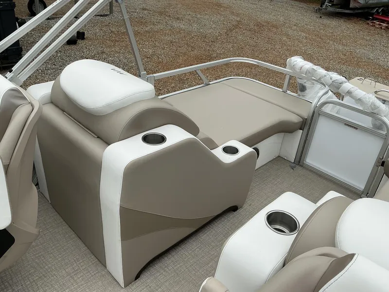 Slide: The Image of 2025 Avalon LSZ 23 Rear Lounger interior with beige and white seating, cup holders, and railing. - 11