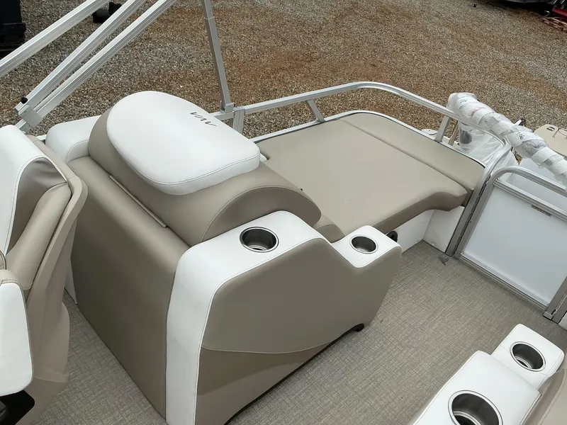 Slide: The Image of 2025 Avalon LSZ 23 Rear Lounger with beige and white seating, cup holders, and railing. - 8