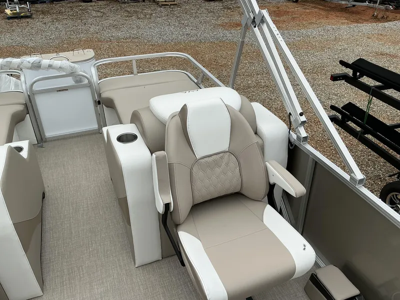 Slide: The Image of 2025 Avalon LSZ 23 Rear Lounger with beige and white seating, cup holder, and railing. - 9