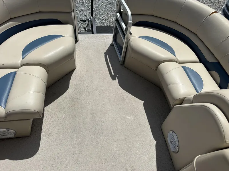 Slide: The Image of 2015 Lowe SS190 boat interior with beige and blue seating. - 5