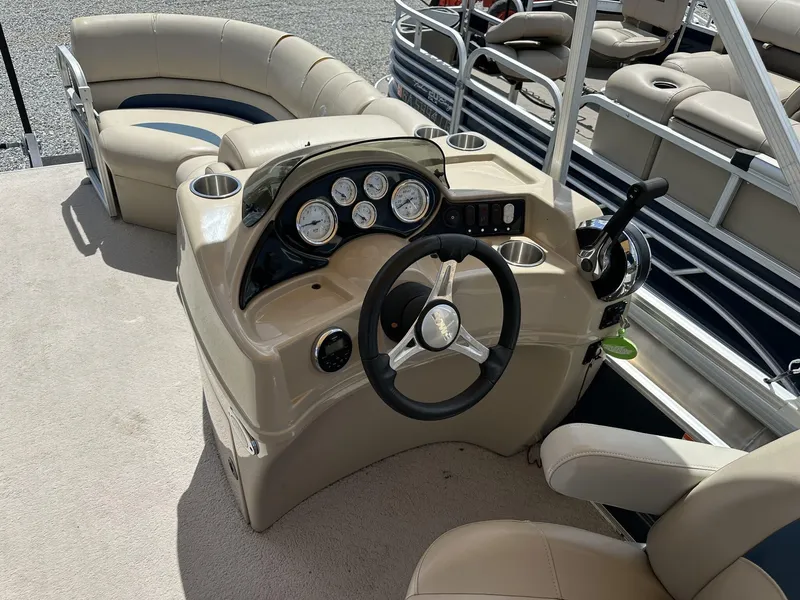 Slide: The Image of 2015 Lowe SS190 boat interior with steering console and seating area. - 8