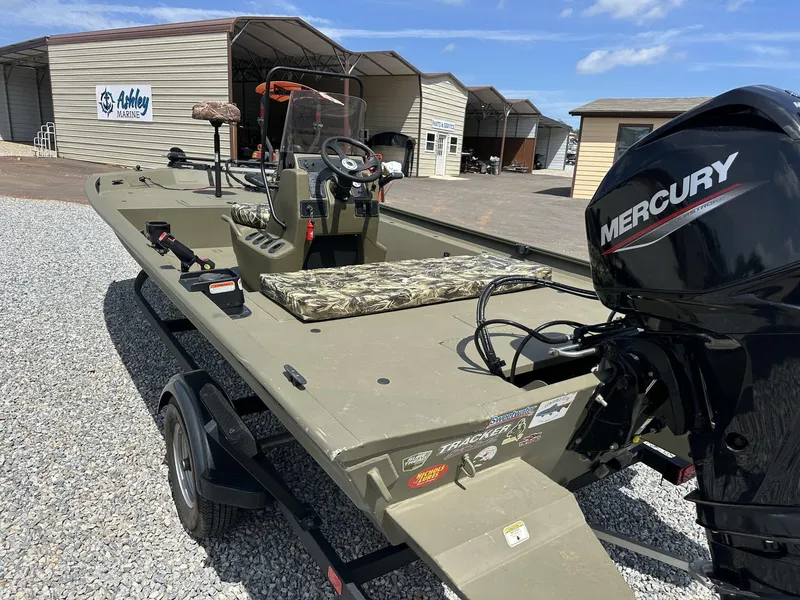 Slide: The Image of 2024 Tracker Grizzly 1860 CC boat with Mercury engine at Ashley Marine dealership. - 11