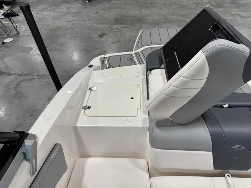 Slide: The Image of 2021 Chaparral 21 SSi boat interior with seating and storage compartments. - 10