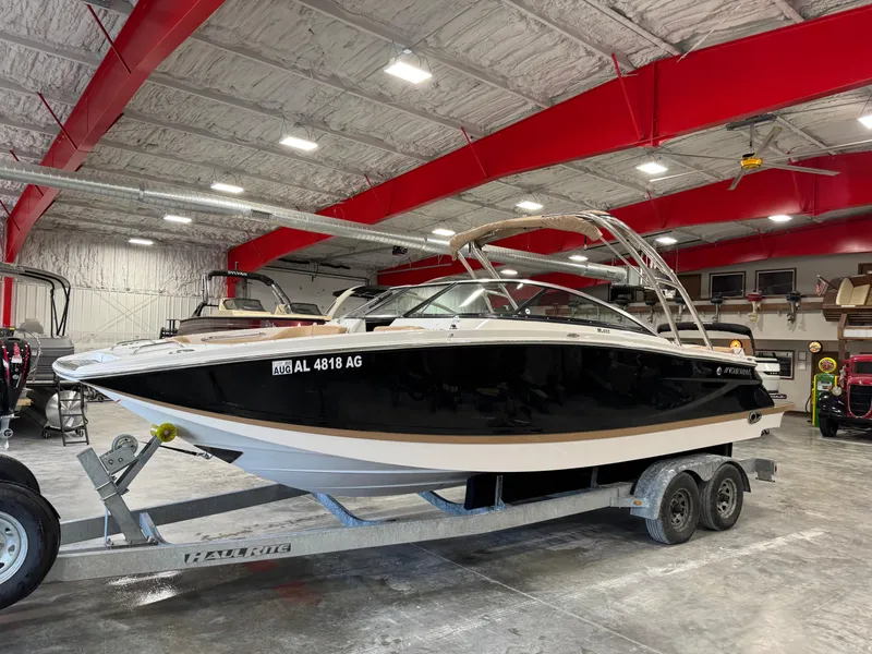 Slide: The Image of 2008 Four Winns SL 262 boat on trailer in indoor storage facility. - 1
