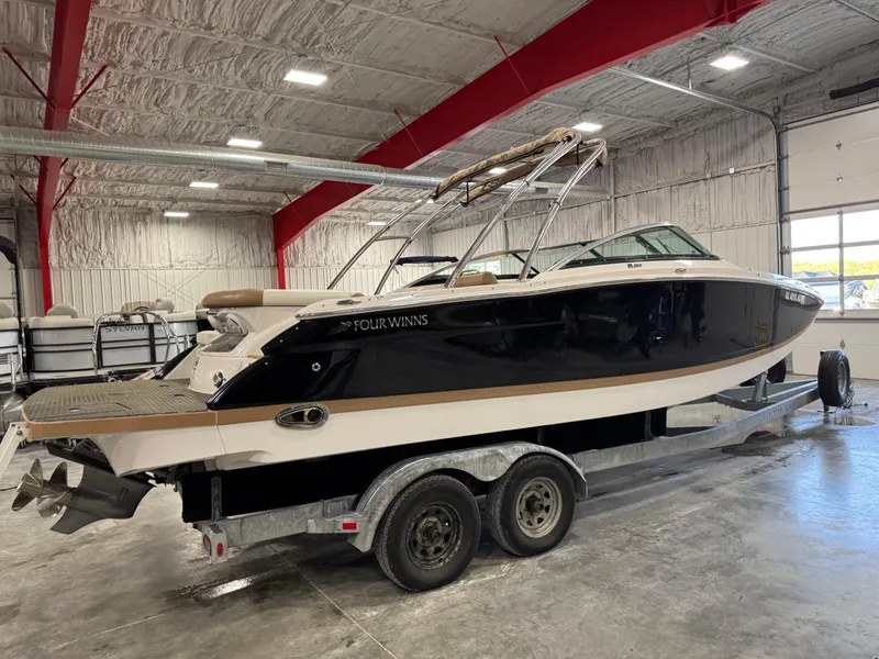 Slide: The Image of 2008 Four Winns SL 262 boat on trailer in indoor storage facility. - 4