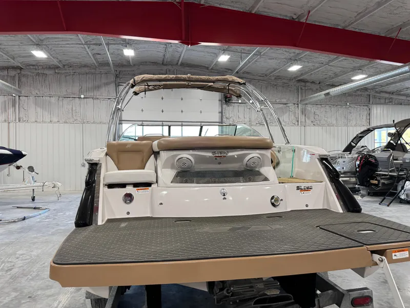Slide: The Image of 2008 Four Winns SL 262 boat in a showroom, rear view with swim platform. - 5