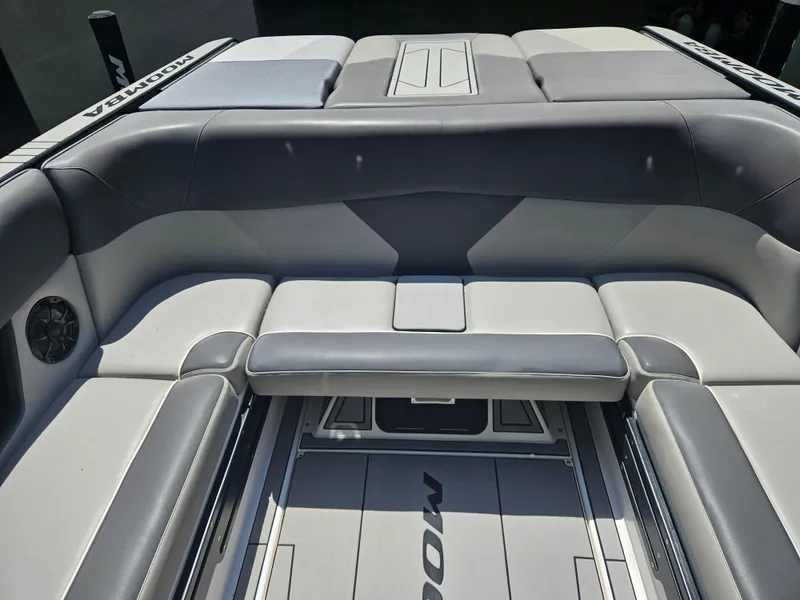 Slide: The Image of 2020 Moomba Max boat interior with gray seating and sleek design. - 14