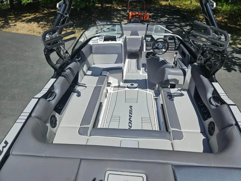 Slide: The Image of 2020 Moomba Max boat interior with spacious seating and modern dashboard design. - 15