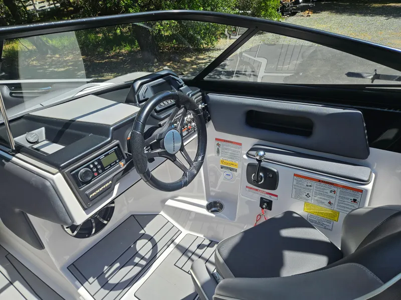 Slide: The Image of 2020 Moomba Max boat interior with steering wheel and control panel. - 18