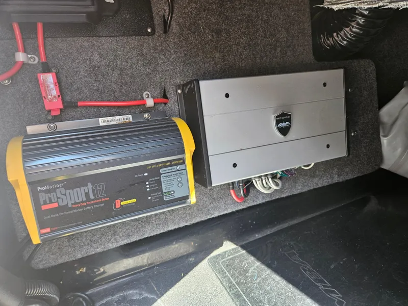 Slide: The Image of 2020 Moomba Max boat electrical components, featuring ProSport12 charger and amplifier setup. - 23