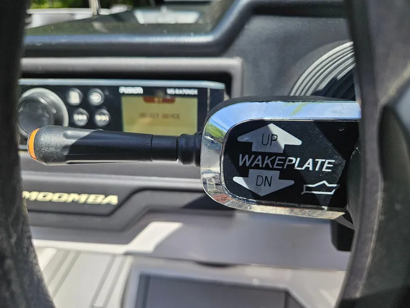 Slide: The Image of 2020 Moomba Max boat dashboard with wakeplate control lever and audio system. - 30