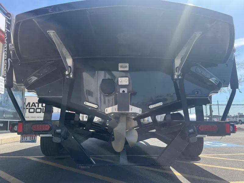 Slide: The Image of Rear view of a 2014 Nautique 230 TEAM EDITION boat on a trailer. - 5
