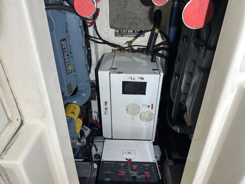 Slide: The Image of Engine compartment of a 1998 Tiara Yachts 4000 Express, showcasing mechanical components. - 36