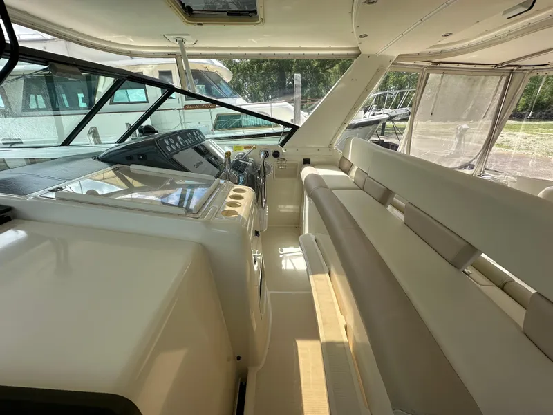 Slide: The Image of 1998 Tiara Yachts 4000 Express interior with helm and seating area. - 42