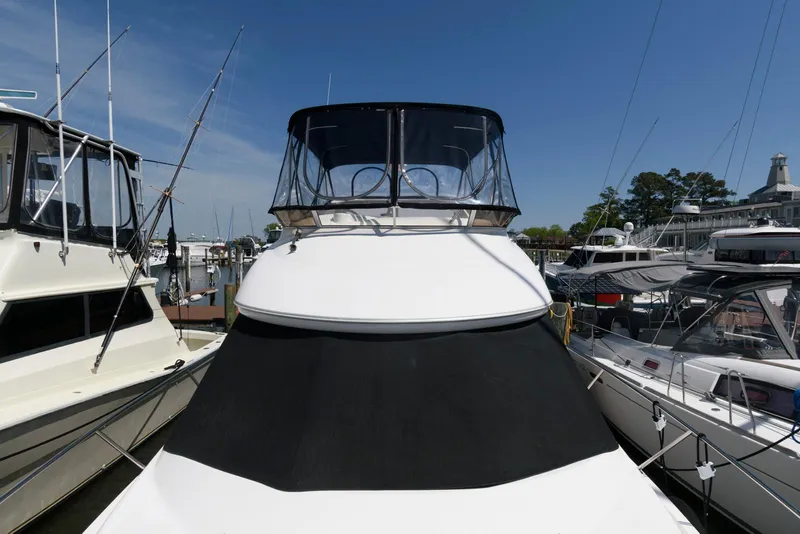 Slide: The Image of 2007 Meridian 341 Sedan yacht docked at marina under clear blue sky. - 10