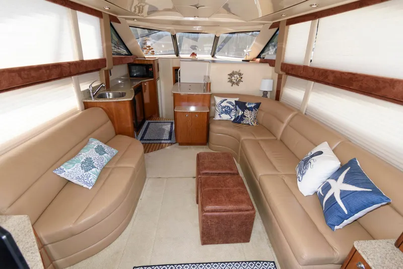Slide: The Image of Luxurious interior of a 2007 Meridian 341 Sedan yacht with plush seating and nautical decor. - 11