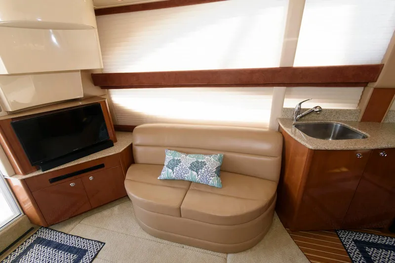 Slide: The Image of 2007 Meridian 341 Sedan interior with leather seating, TV, and kitchenette. - 13