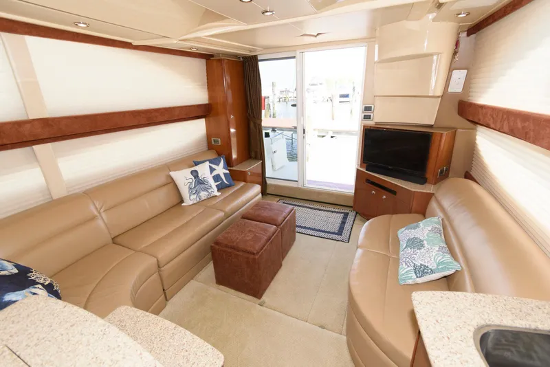Slide: The Image of Luxurious interior of a 2007 Meridian 341 Sedan yacht with leather seating and modern decor. - 14