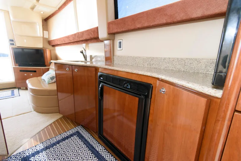 Slide: The Image of Luxurious interior of 2007 Meridian 341 Sedan yacht with modern kitchen amenities. - 16