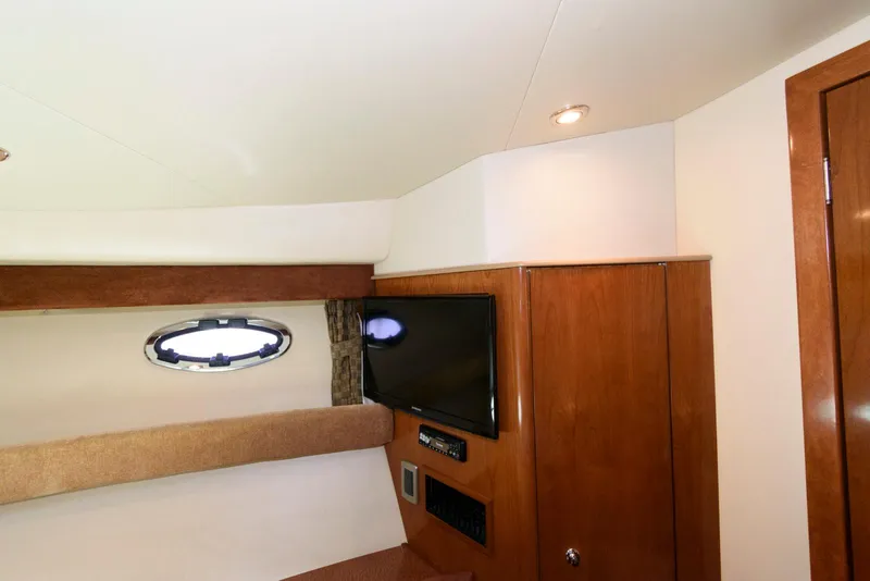 Slide: The Image of Interior of 2007 Meridian 341 Sedan yacht with TV and wooden cabinetry. - 18