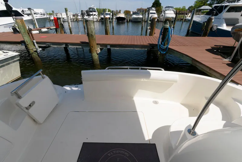 Slide: The Image of 2007 Meridian 341 Sedan yacht docked at a marina with wooden piers. - 2