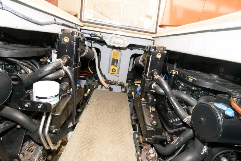 Slide: The Image of Engine room of a 2007 Meridian 341 Sedan yacht, showcasing dual engines and mechanical components. - 21