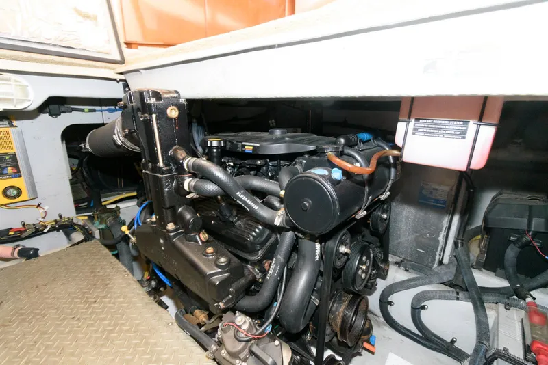 Slide: The Image of Engine compartment of a 2007 Meridian 341 Sedan boat, showcasing mechanical components and wiring. - 22