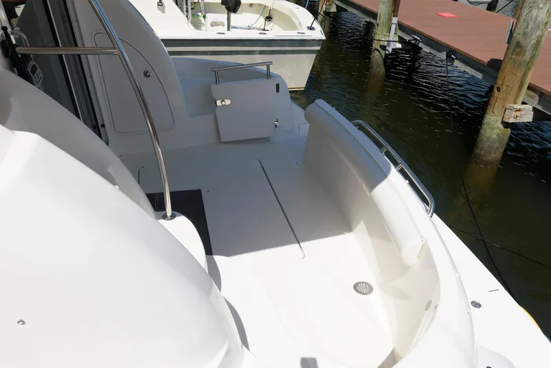 Slide: The Image of 2007 Meridian 341 Sedan yacht deck with seating, docked at marina. - 3