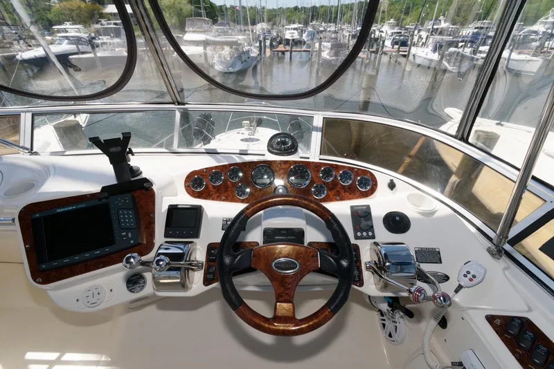Slide: The Image of 2007 Meridian 341 Sedan helm with navigation instruments and steering wheel, docked at marina. - 8