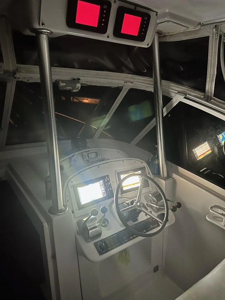 Slide: The Image of Helm of 2000 Luhrs 36 SX boat with navigation equipment and steering wheel. - 2