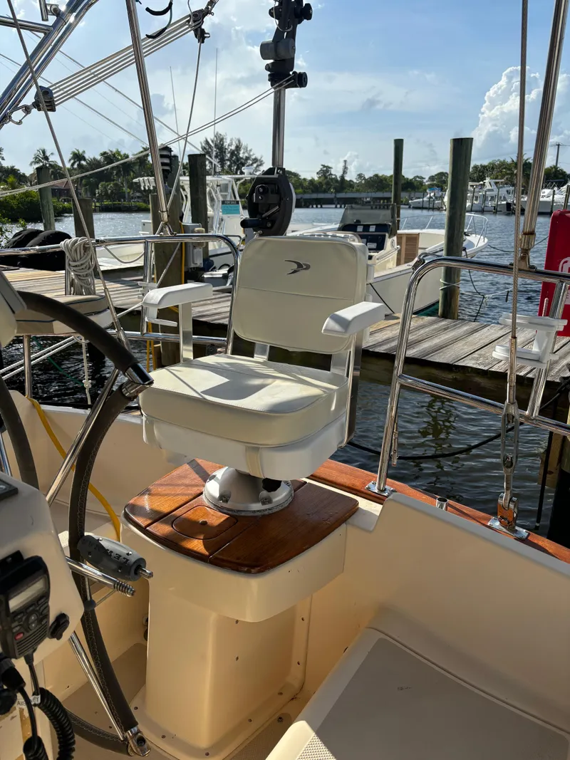 Slide: The Image of Captain's chair on 2005 Island Packet 370 sailboat, docked at marina. - 21