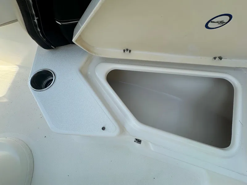 Slide: The Image of Open storage compartment on 2021 NauticStar 211 Hybrid boat interior. - 13