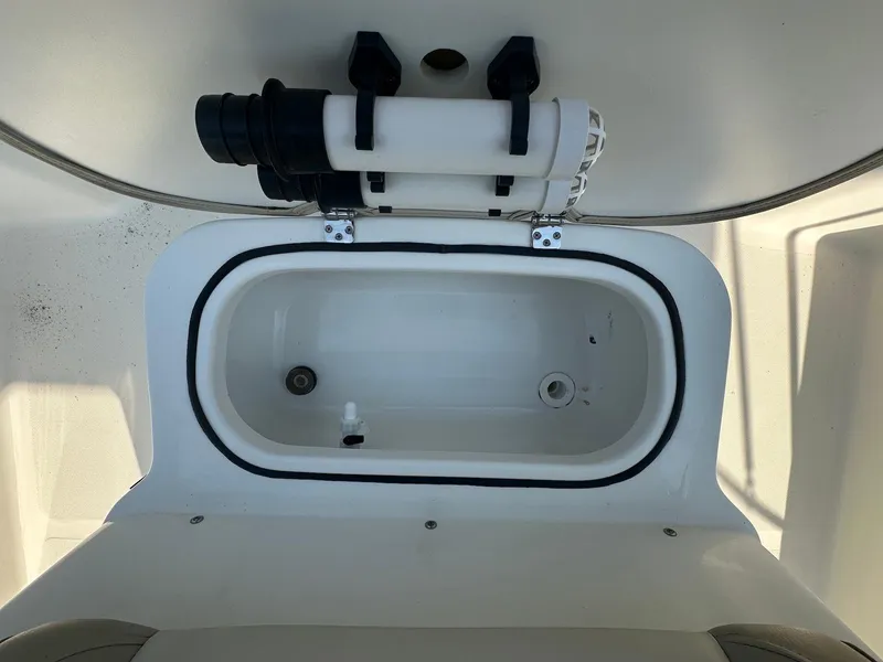 Slide: The Image of 2021 NauticStar 211 Hybrid boat livewell interior view. - 16