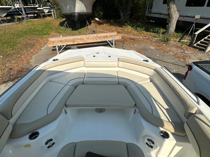 Slide: The Image of 2021 NauticStar 211 Hybrid boat with spacious seating and cup holders. - 26