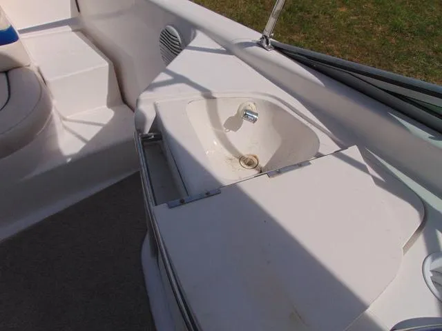 Slide: The Image of 2001 Chaparral 280SSi boat interior with sink and seating area. - 10