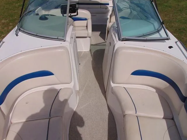 Slide: The Image of 2001 Chaparral 280SSi boat interior with white and blue seating, open cockpit view. - 16